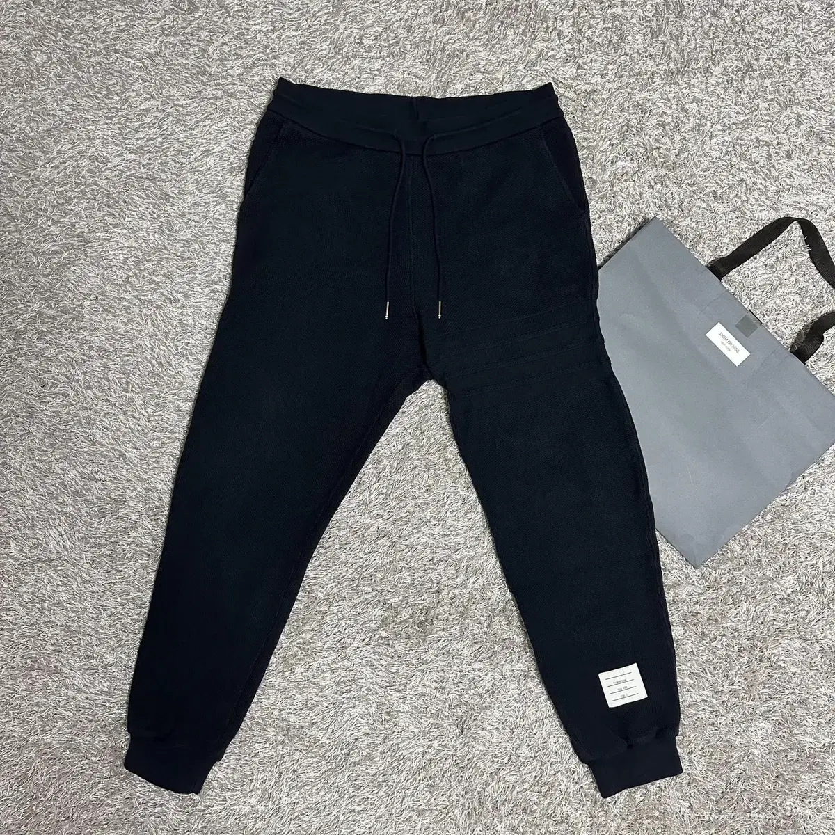 [rio] Thom Browne Waffle Diagonal Armband Jogger Pants