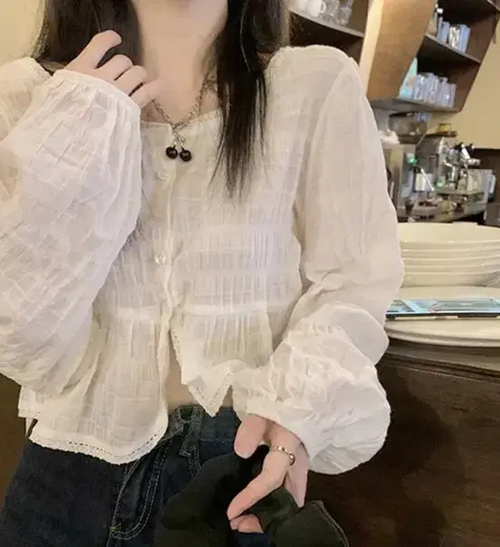 Ivory pleated round blouse