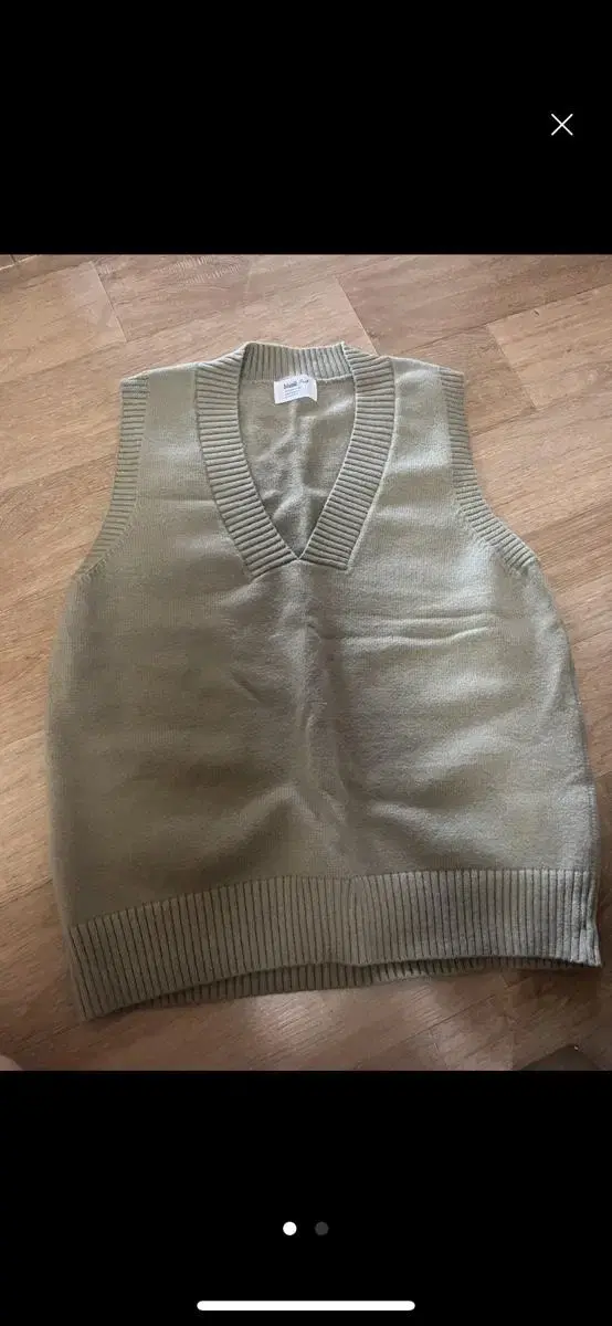 Olive-colored knit vest