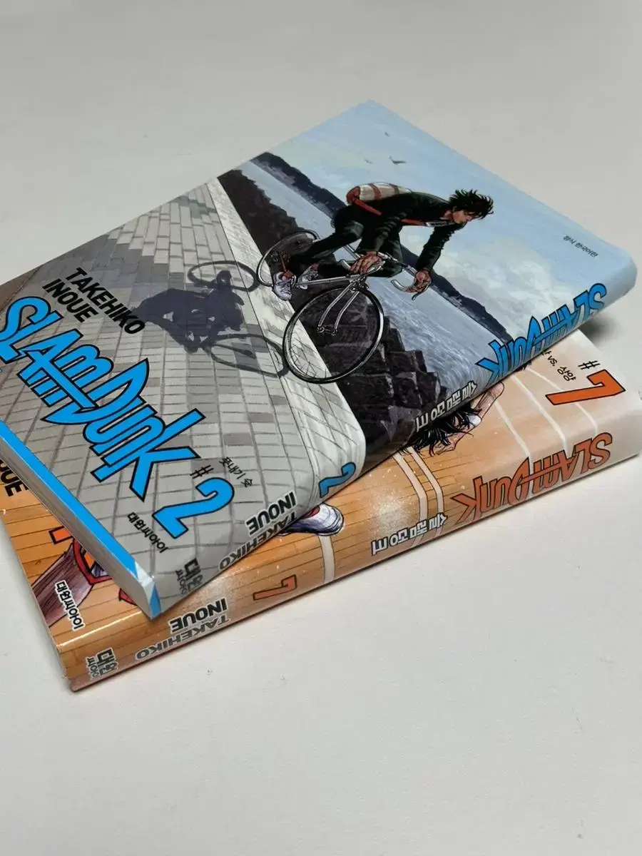 I'm selling two SLAM DUNK comic books, seven of them.