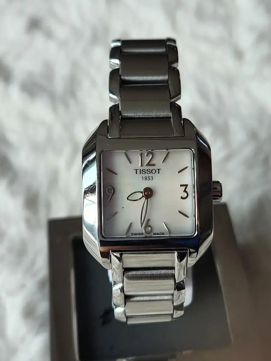 # 32) Tissot T-WAVE Parallel Above Mother of Pearl