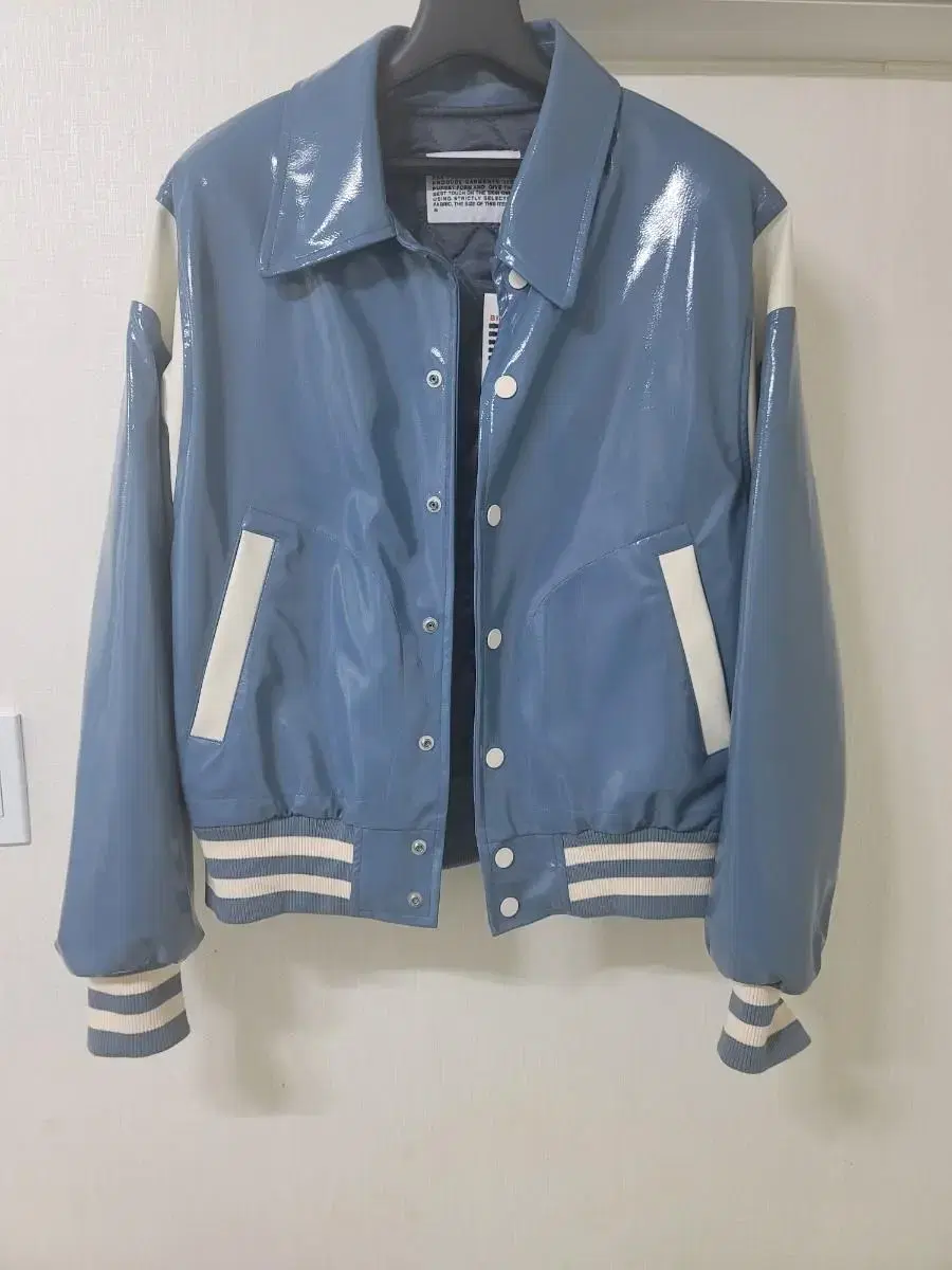 I'm selling a glossy varsity jacket in a bee's day suit.