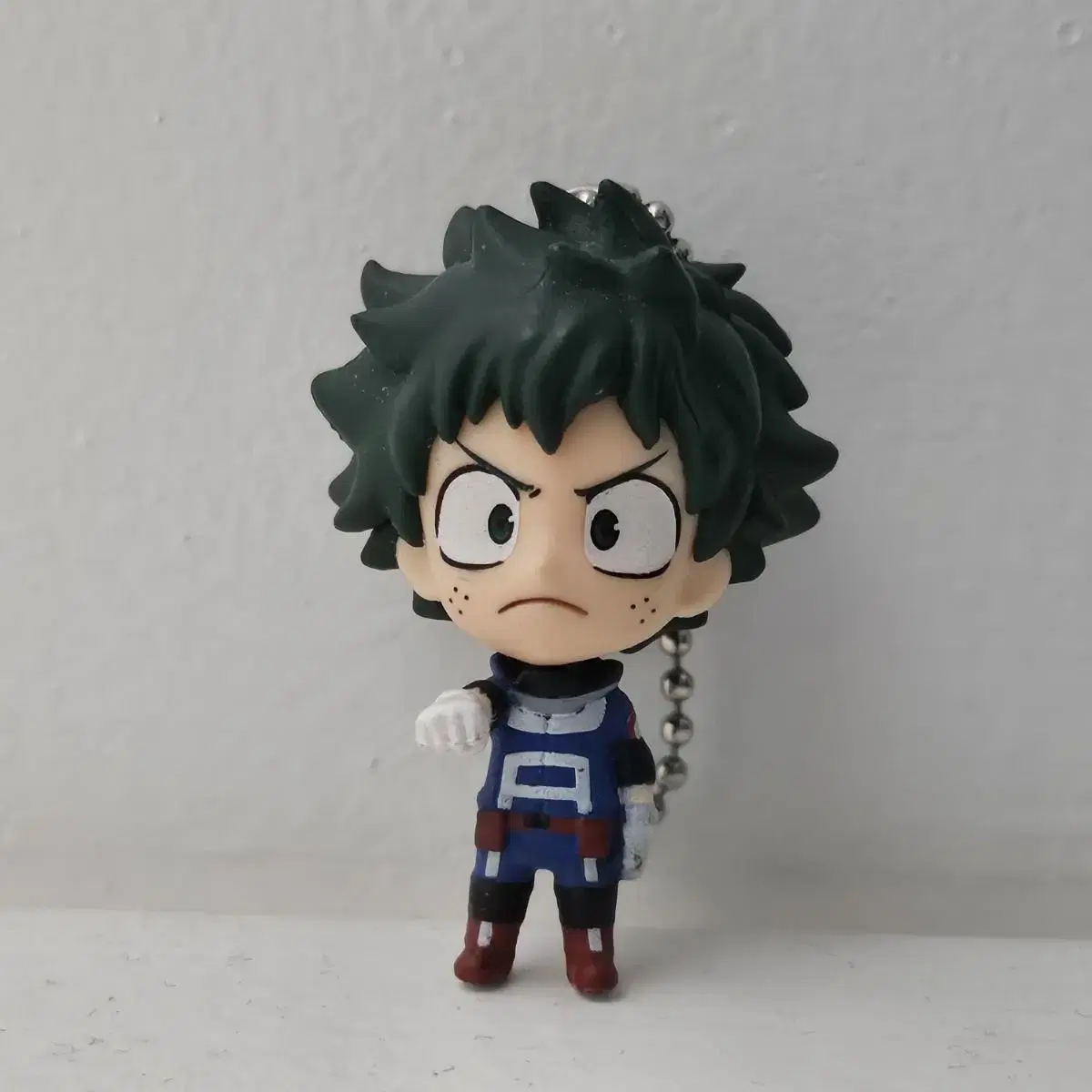 A Midoriya figure shaking its fist at you.