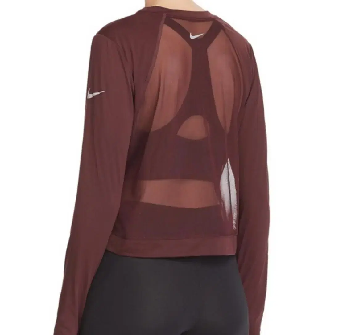 Nike running top, women's size M, for sale.