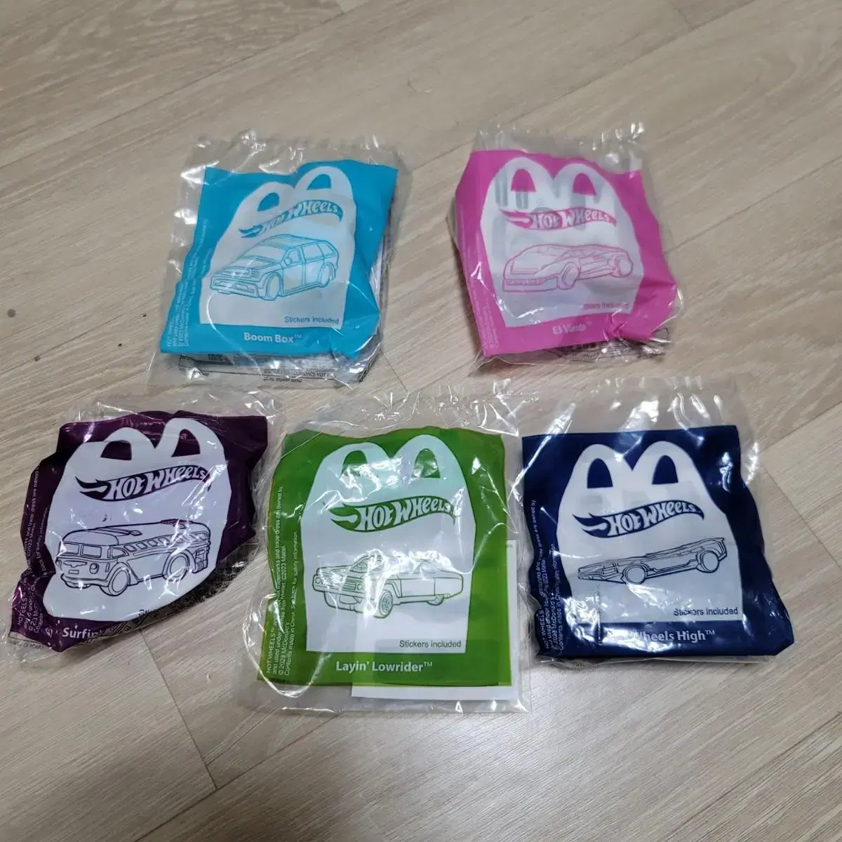 A package of 5 unsealed Happy Meal Hot Wheels