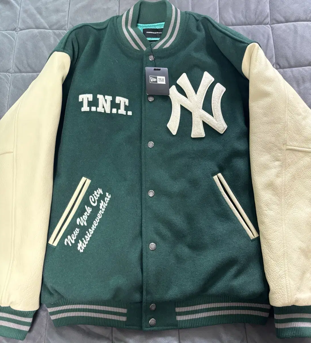 100) This Is Never That X New Era Varsity Jacket