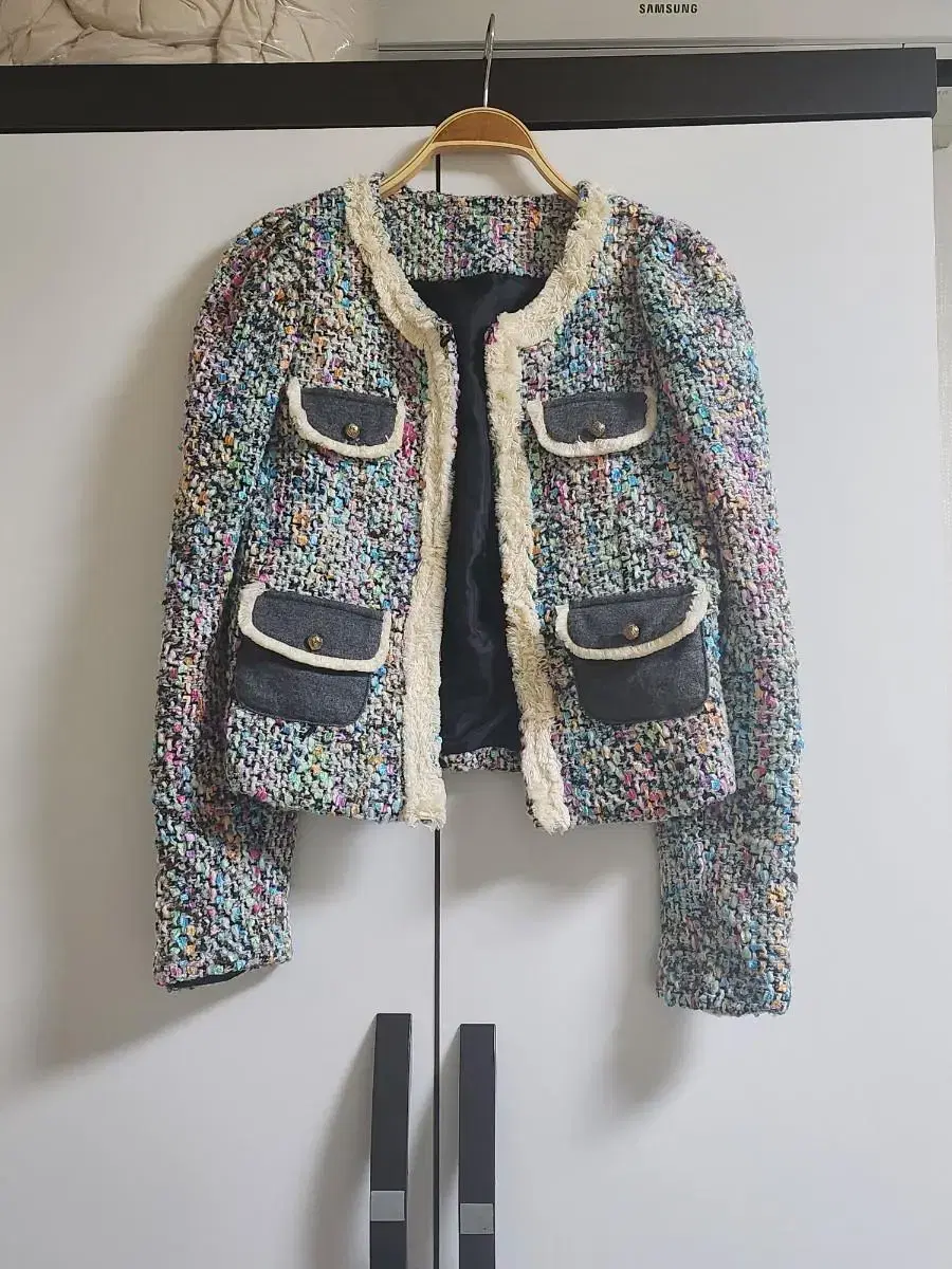 Coat over a tweed jacket