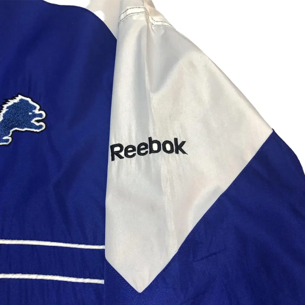 (No.9) NFL TEAM APPAREL Reebok 블루 바람막이