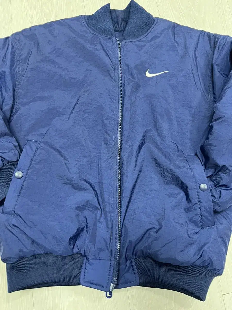 Nike 90s big swoosh reversible short padded jumper size small for sale.