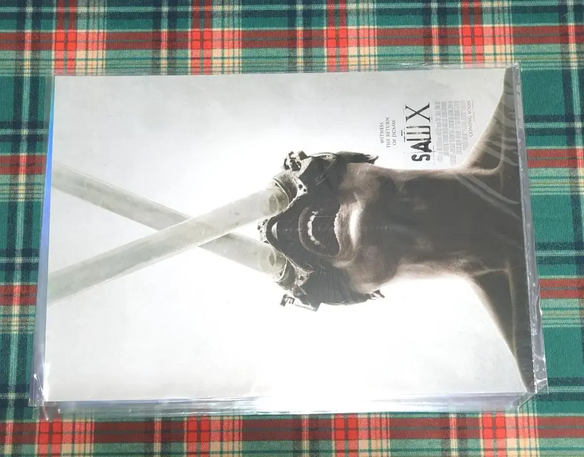 Sells Saw X posters.