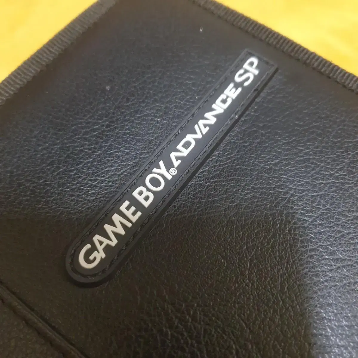 Game Boy SP logo case, scratches on the back of the bag