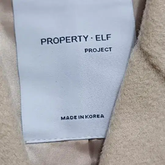 PROPERTY ELF 퍼프어깨 모직 롱코트