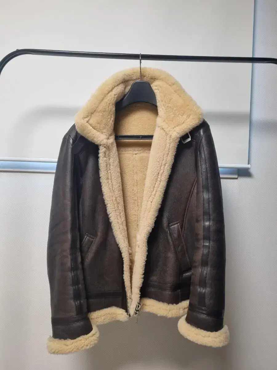 Noir L'Hermès Mustang in Brown Shearling, size 48