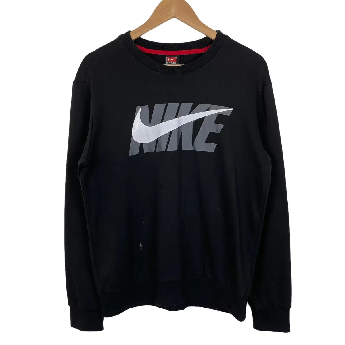 Black top with printed Nike logo