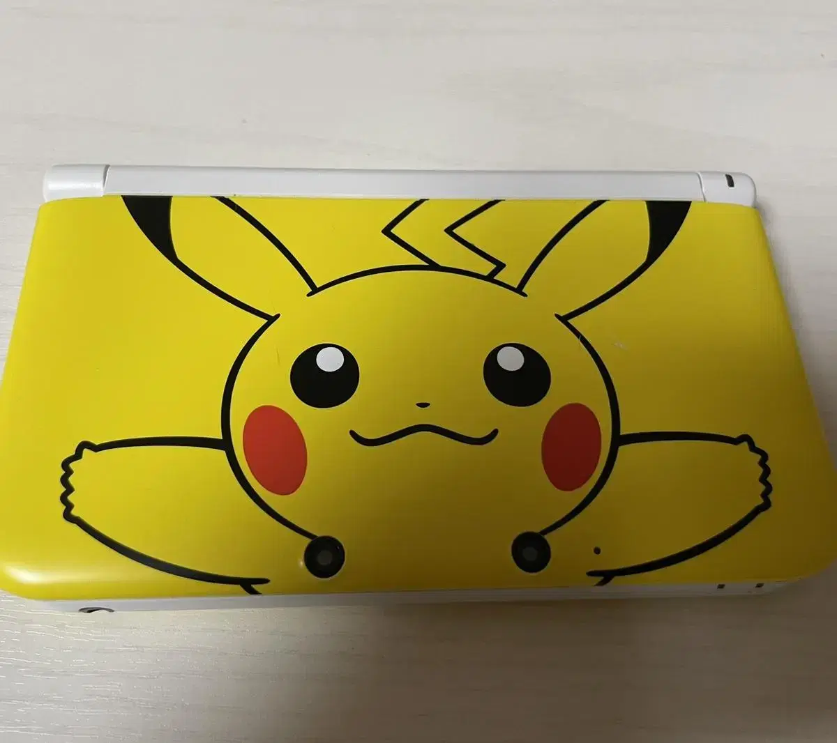 Nintendo 3DS XL Pikachu limited edition and Pokemon game chip