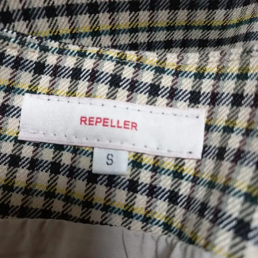 REPELLER 핀턱주름 울혼방 체크 미디스커트