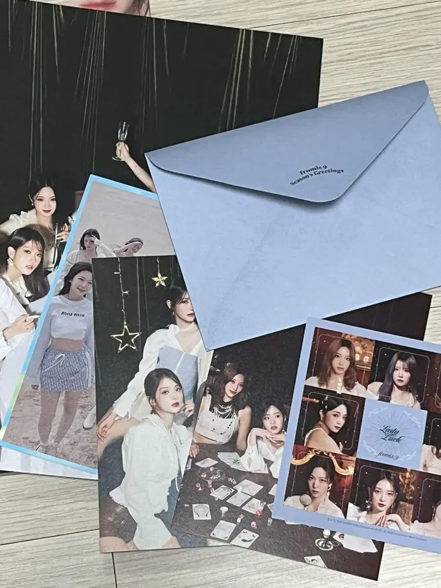 Fromis 9 season's greetings photography, stickers, photobooks