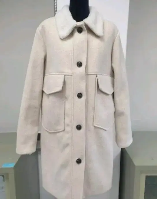 A really cute and cuddly ivory quilted coat.