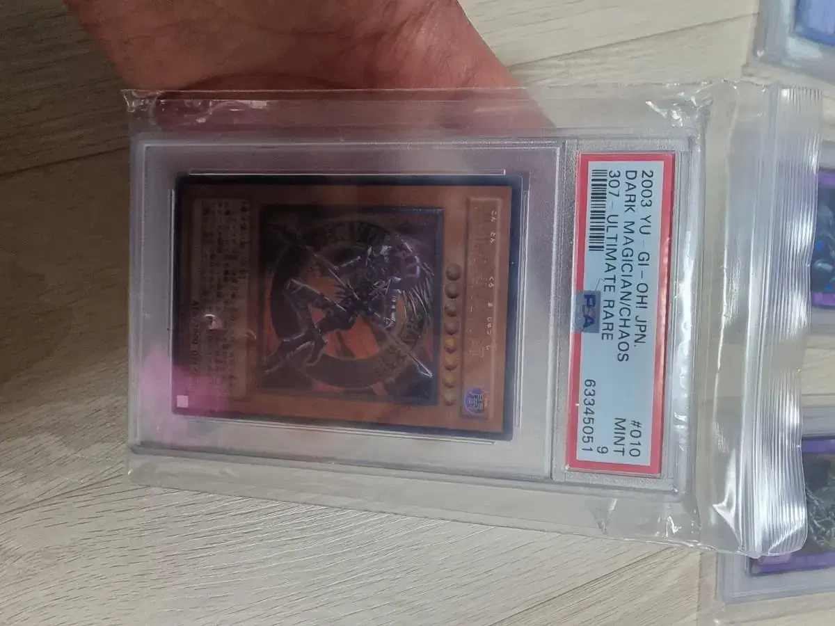 Selling a Chaos Warlock 307-010 first edition early PSA 9-point rated kard.