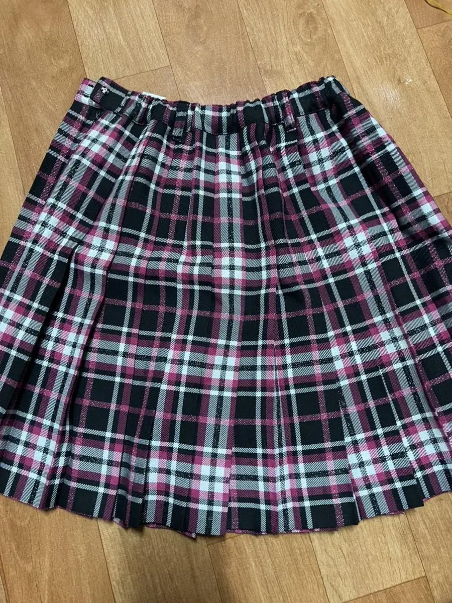 Shiny pink checked skirtPriceSuggestedAvailable