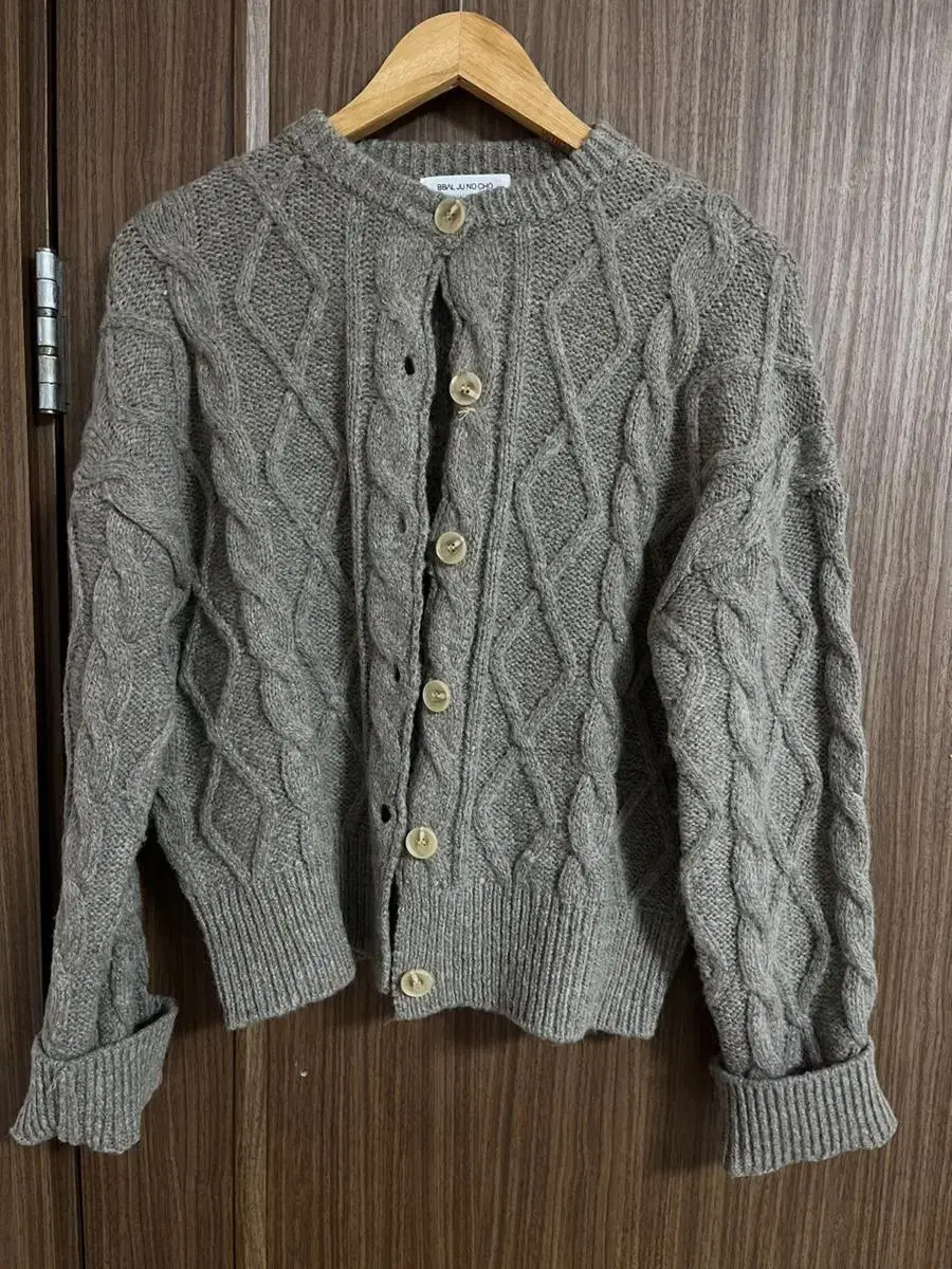 I'm selling my (unworn) avant-garde brown knit cardigan.