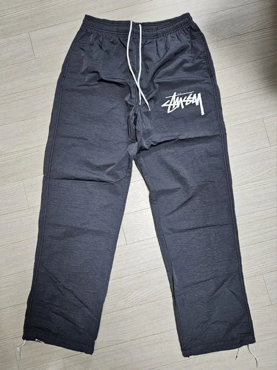 [S] Nike x Stussy Beach Pants Off-White Noir