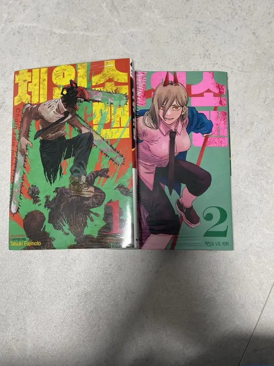 Chainsaw Man volumes 1 and 2 sealed sells