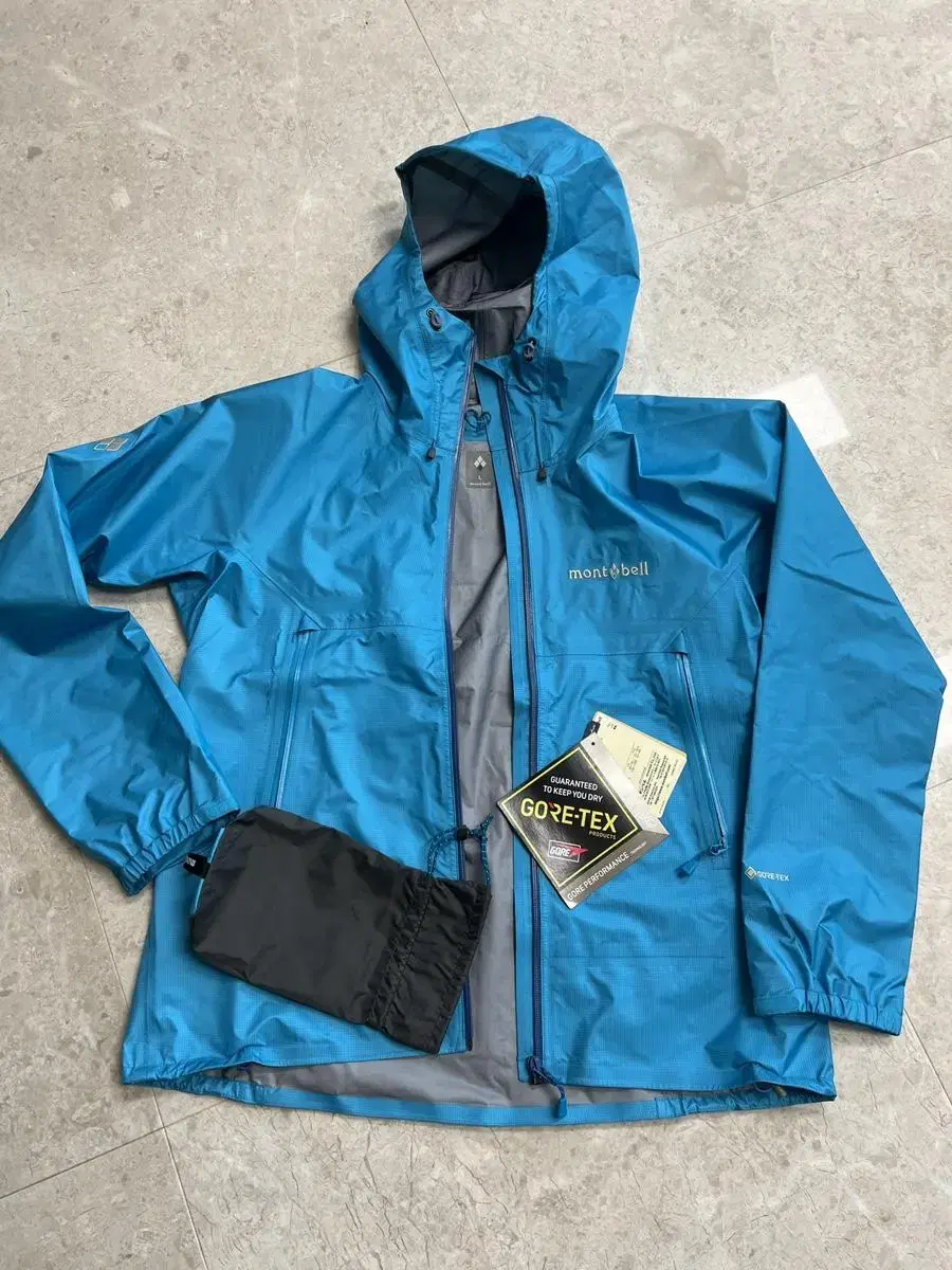 (New, unworn) Montbell Stormcruiser Gore-Tex Jacket Women's Size L Light Blue