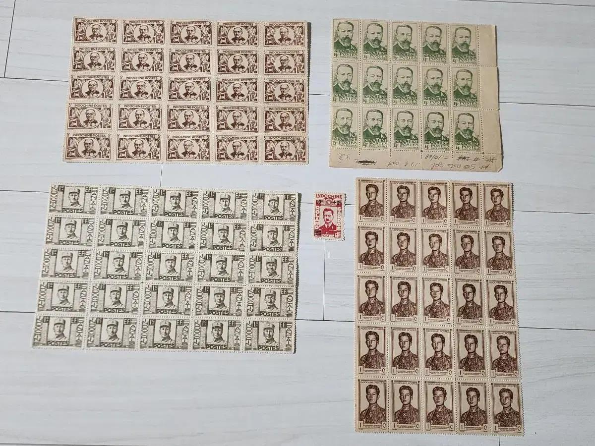 A bulk of 4 sheets of 25 very hard-to-find Indochina stamps (91 total).