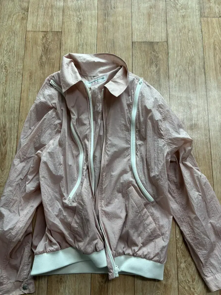 L TheMuseumVisitor Curved Zip Windbreaker Pink sells