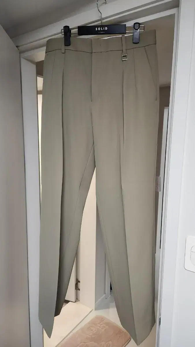 Wooyoung Mi beige straight fit pants for sale.