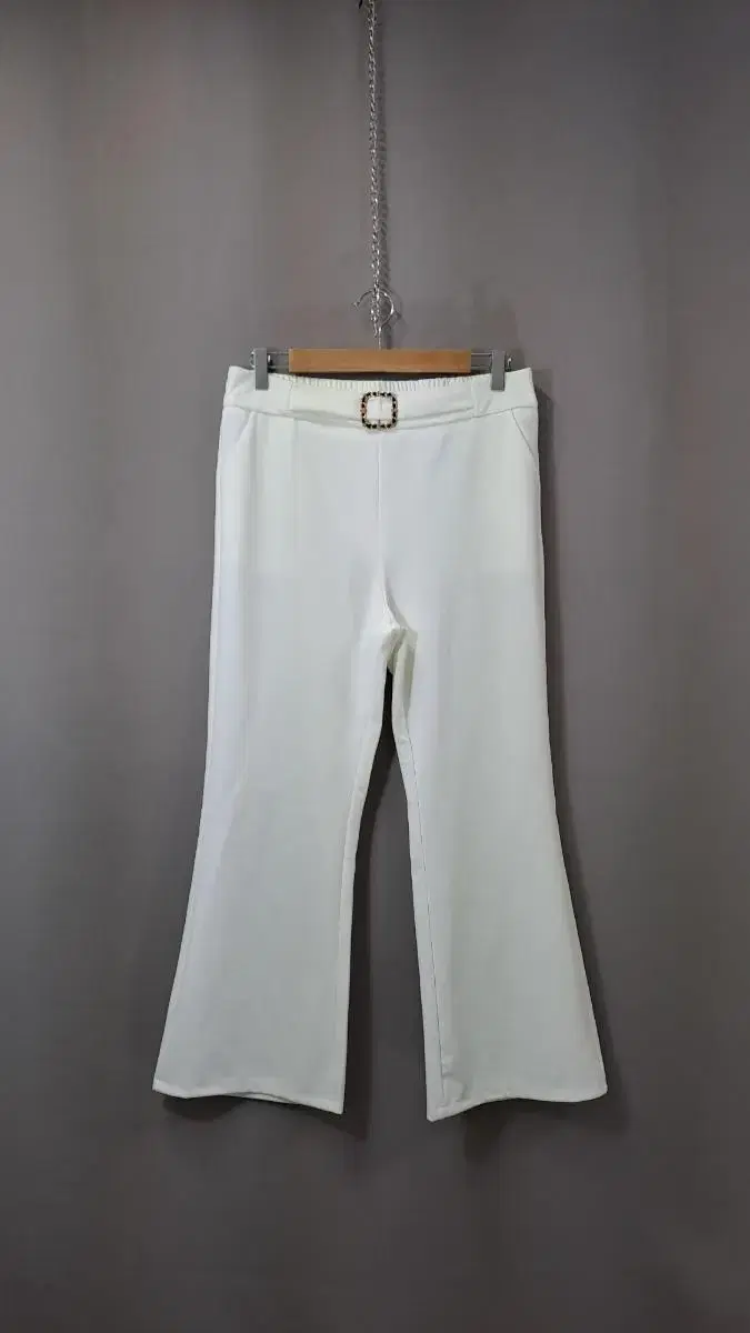 White pants with beltline buckle points PB