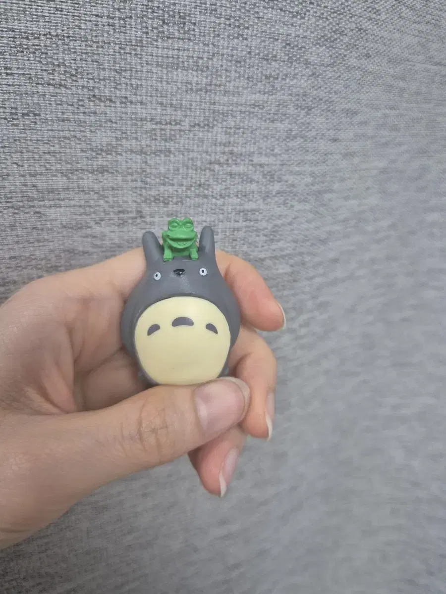 Totoro figure with frog on top