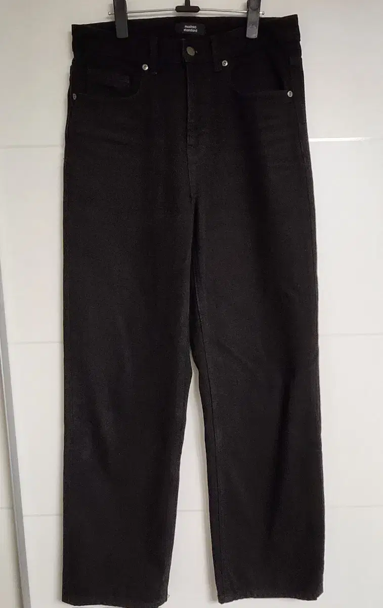 Size 29 in black denim, straight and untreated