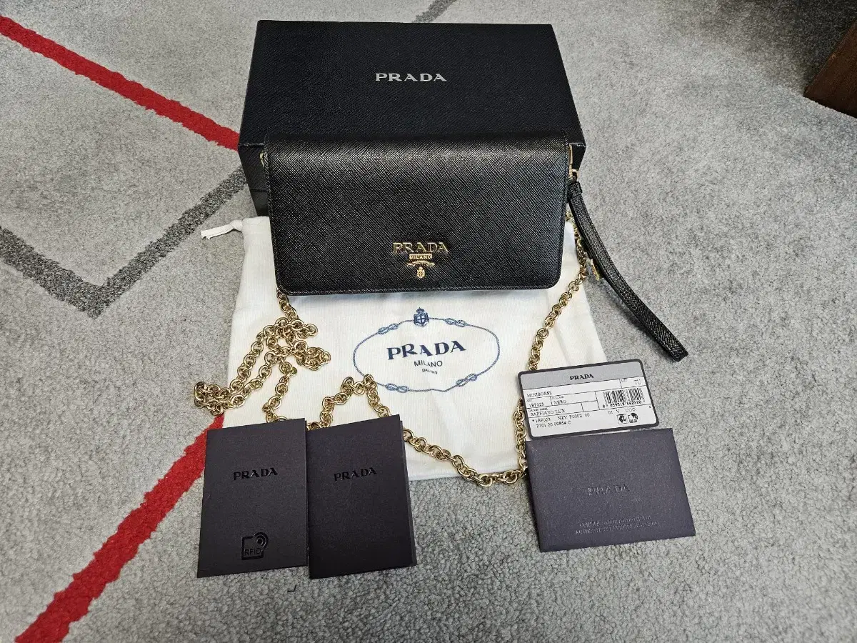 Prada Saffiano Clutch and Keum Chain Crossbody BagSagerevel