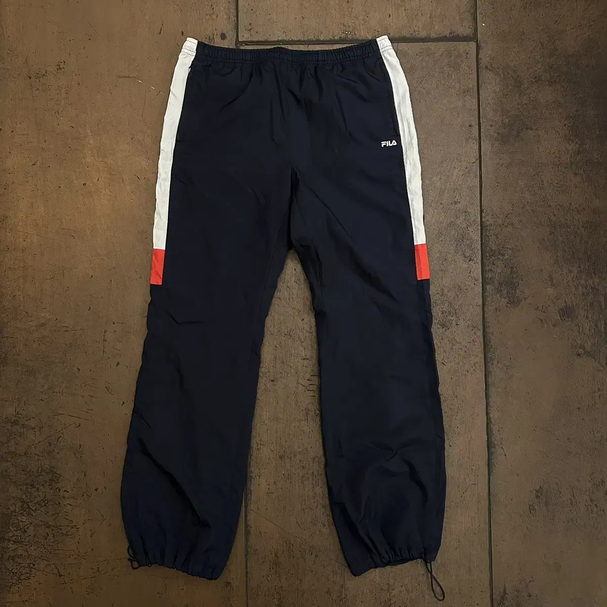 [Size 34] Fila Woven Track Pants are in limited supply.