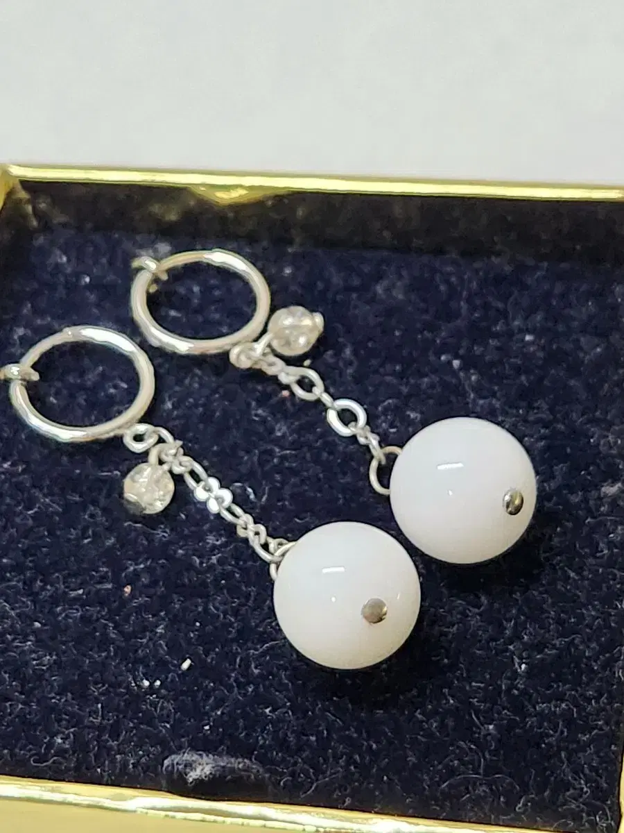 White gemstone earrings