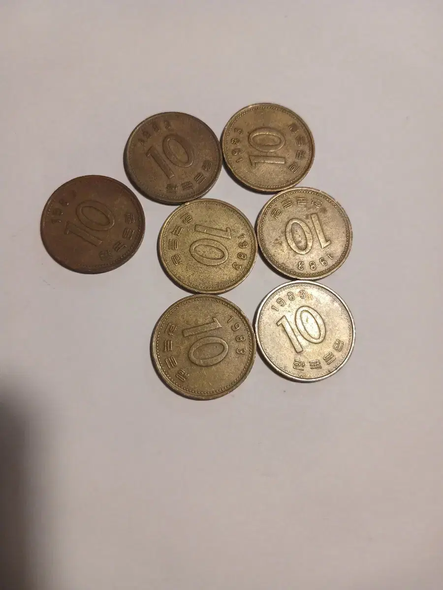 Seven 10 won coins in 1983