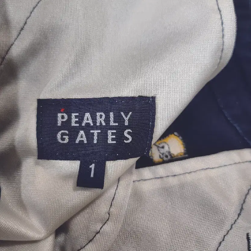 파리게이츠(PEARLY GATES) 네이비 프린팅 숏 스커트