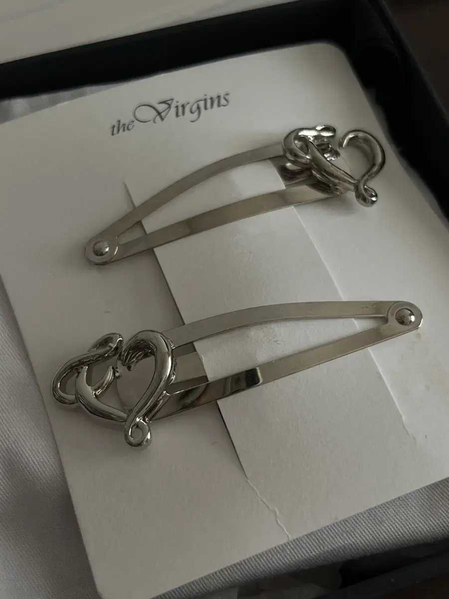 The virgins heart logo hairpin