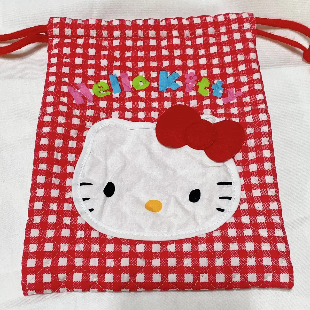 Sanrio Hello Kitty '96 classic quilted pouch with quilted pow.