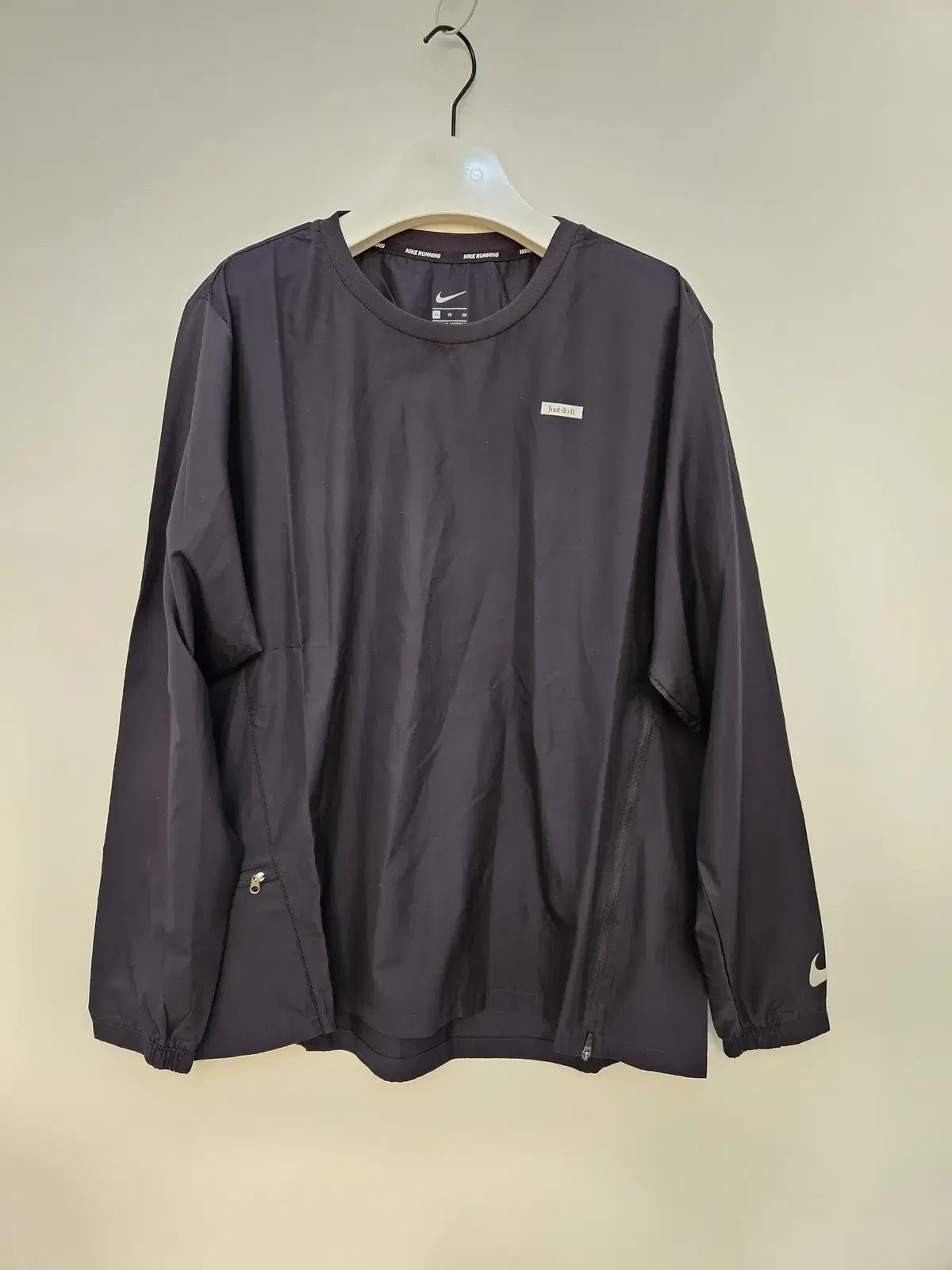 Selling a Nike nylon long sleeve t-shirt (new).