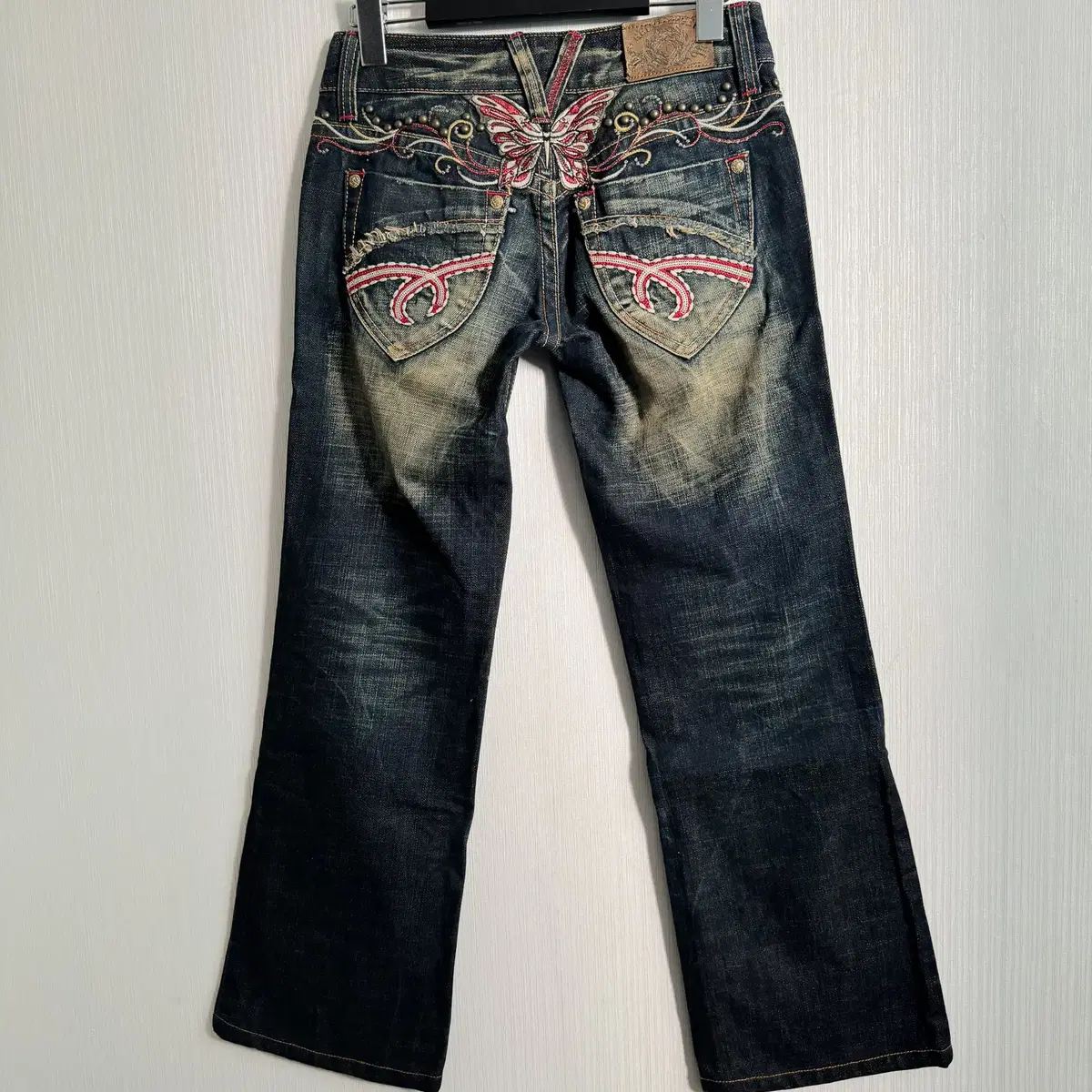 Red pepper back butterfly denim pants