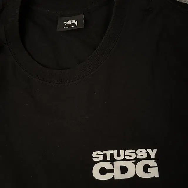 [L] 스투시 x cdg 서프맨 티셔츠 블랙