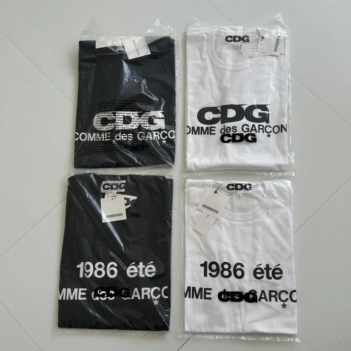 CDG 화이트 반팔 티셔츠(XXL사이즈,새상품)