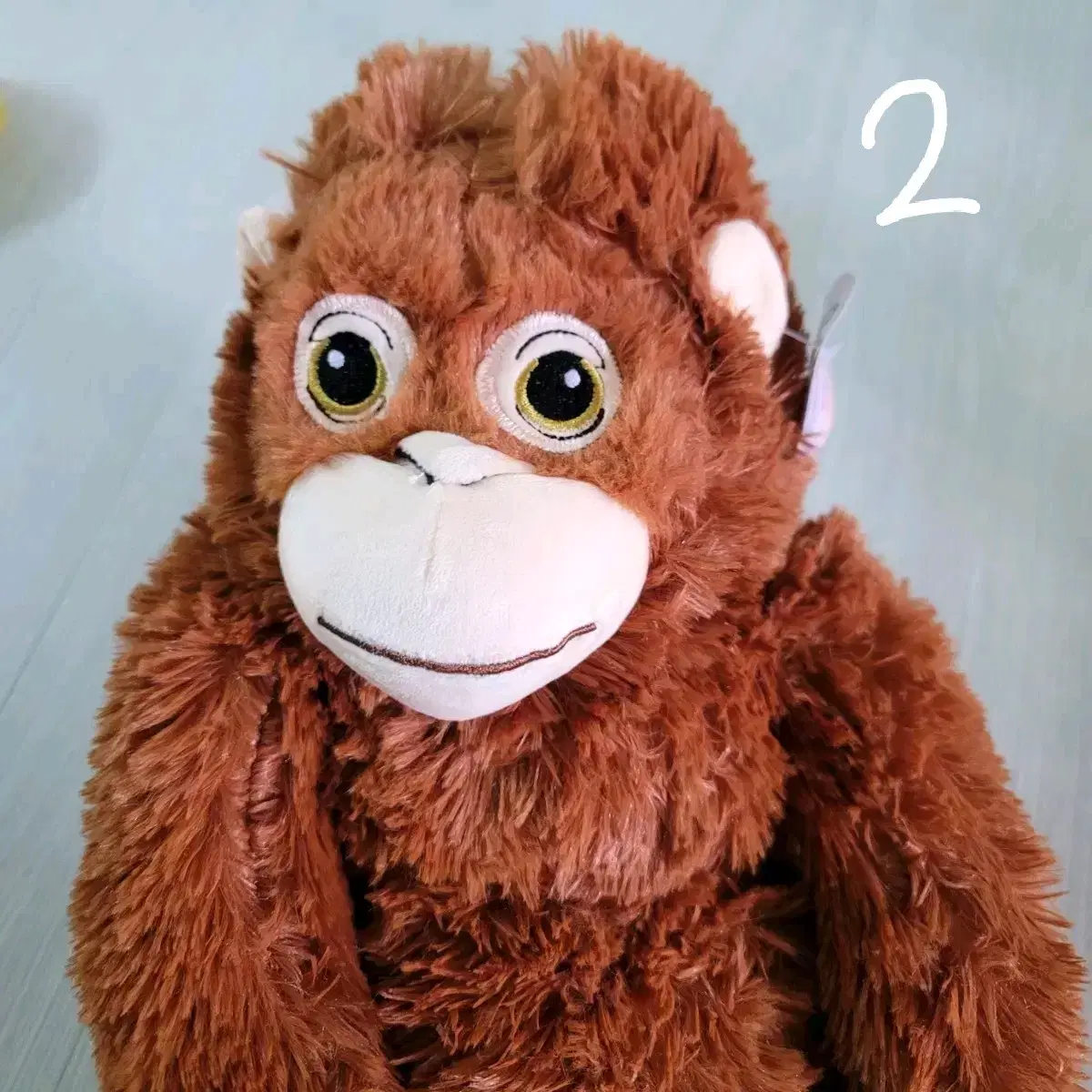 Wutan the orangutan sells doll face plucking bags