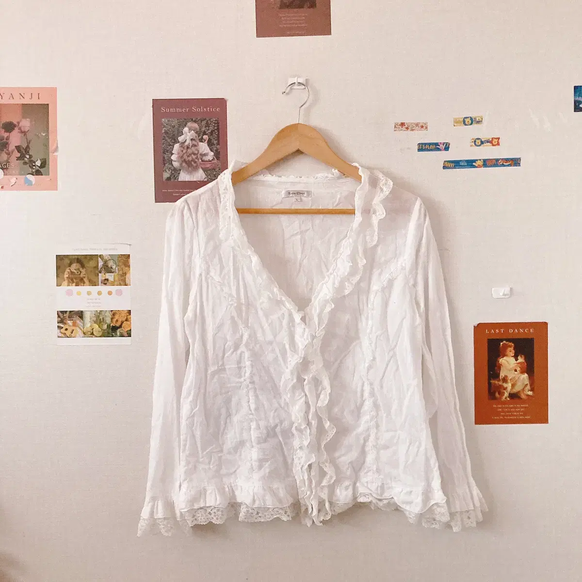 White long-sleeved shirred blouse