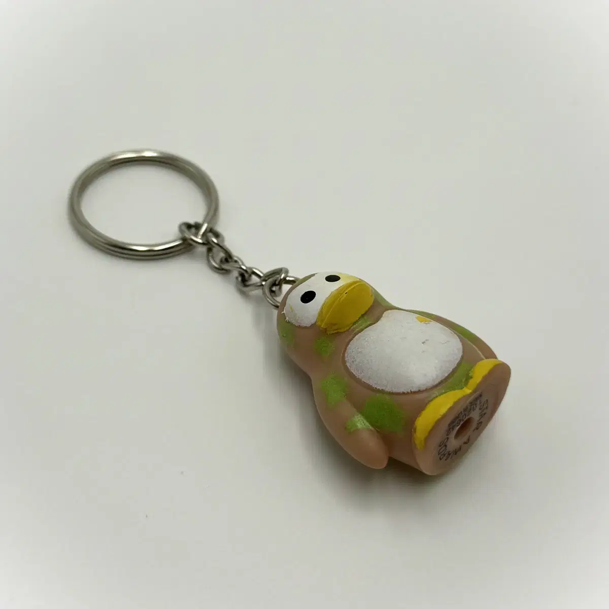 Vintage keychain Penguin Stains of green