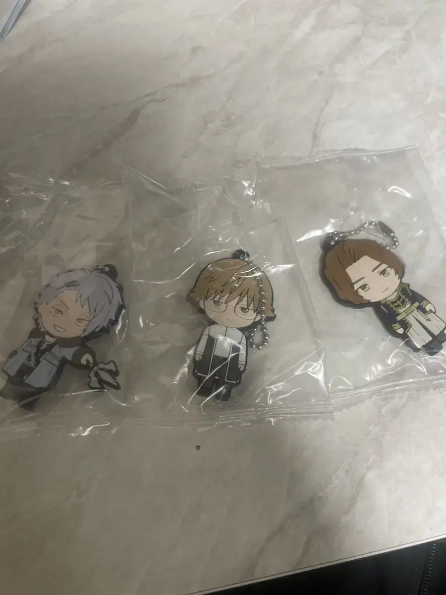 Zhang Song's Pre-Ren Rubber Strap keyring sells in bulk