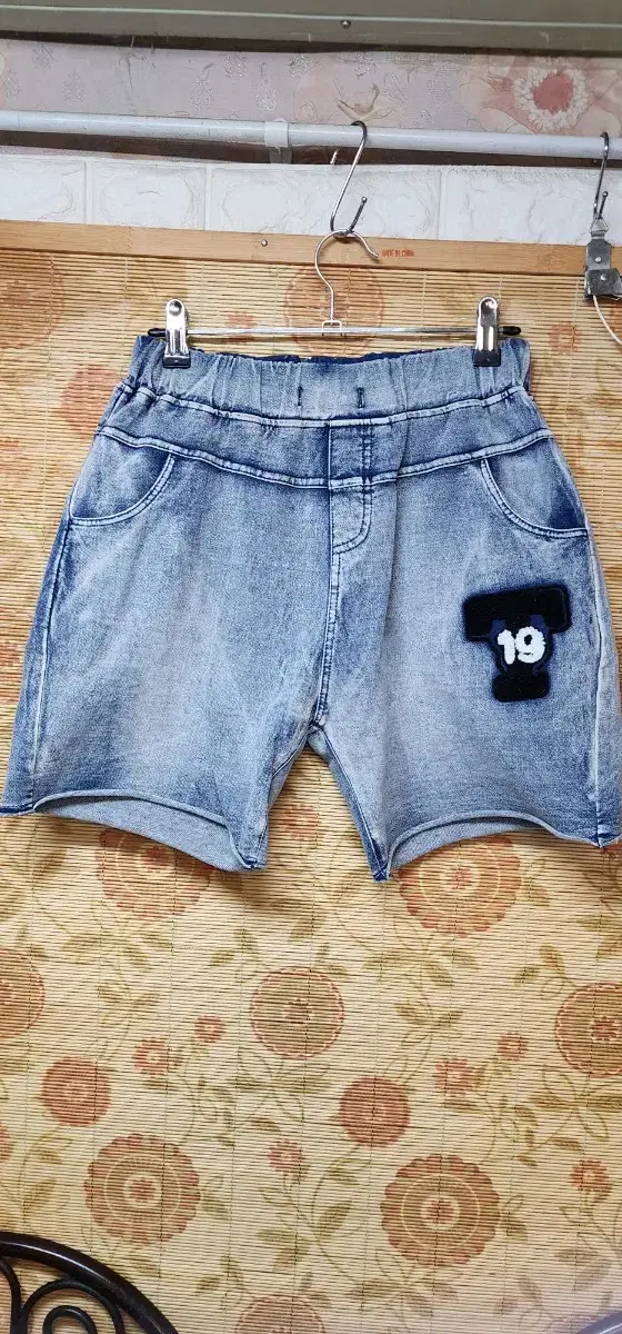 Blue denim shorts, cotton pants, and pants. Each amount